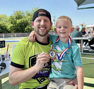 Tyler with his son after a soccer game